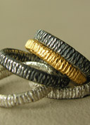 silver rings by Clare de la Torre